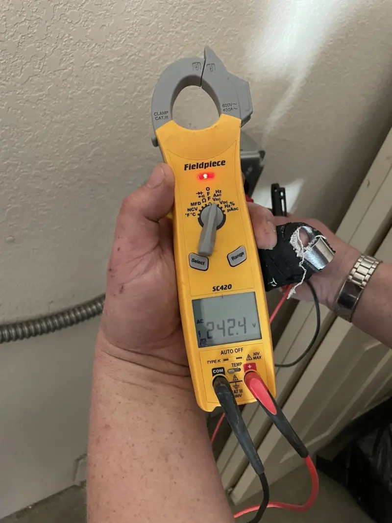 Voltage testing with clamp meter during Ceiling Fan Installation in Fort Pierce South